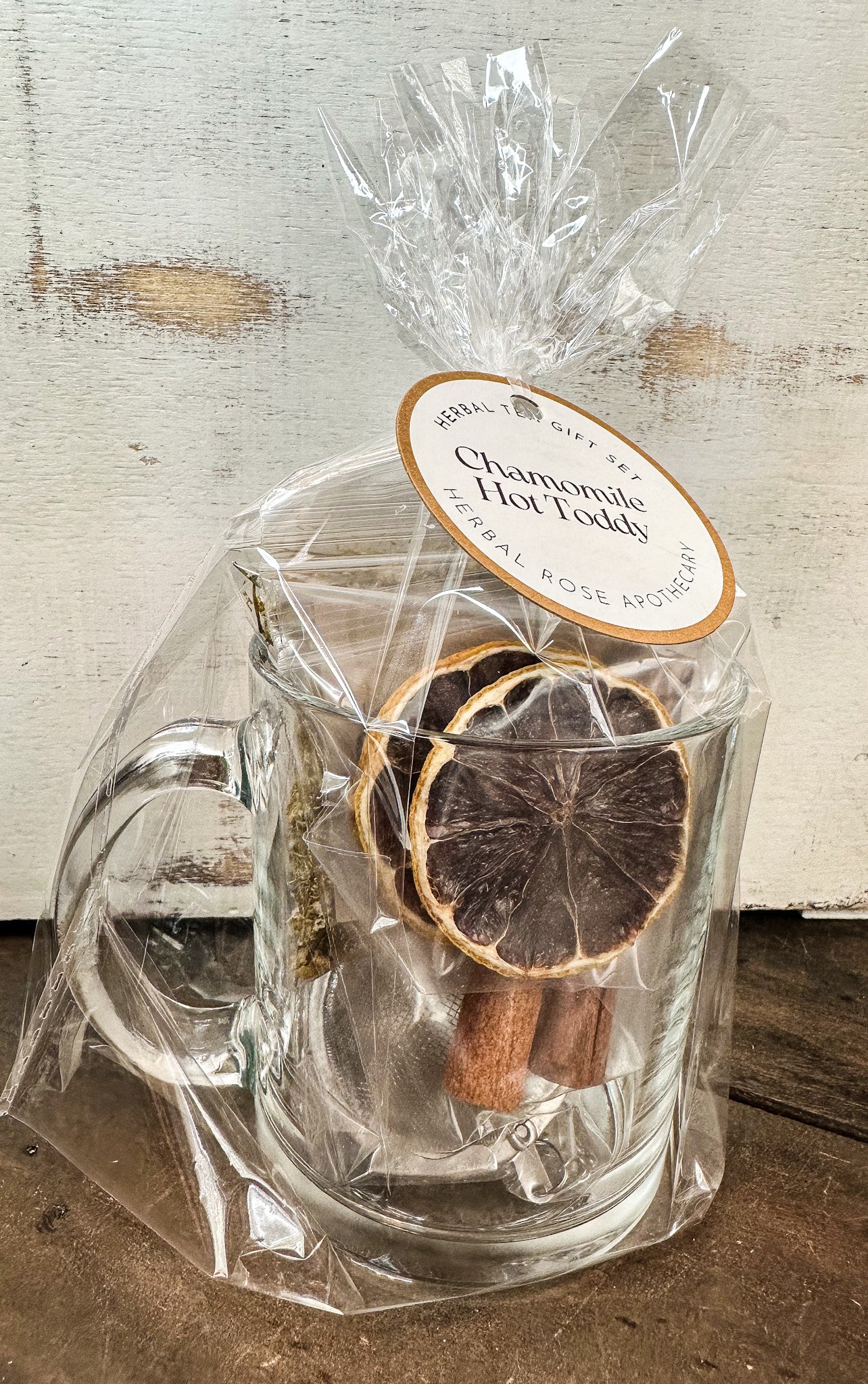 chamomile hot toddy gift set white background and wood table