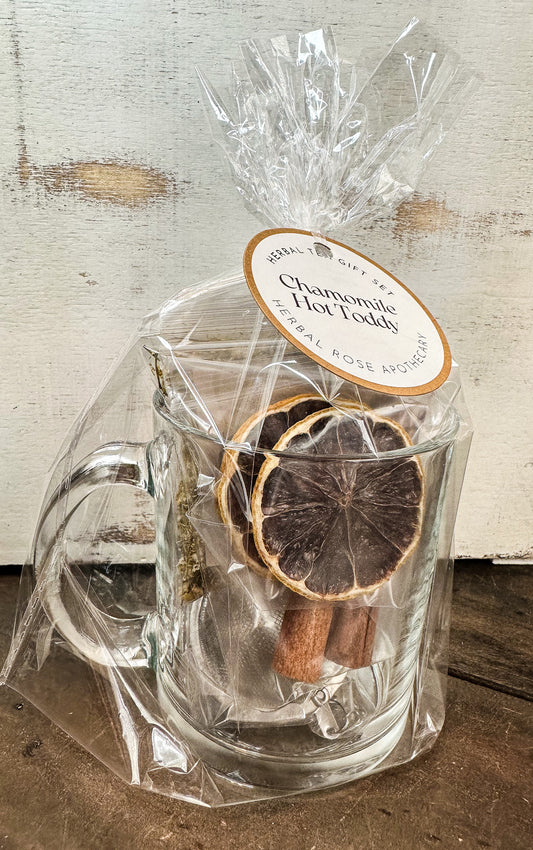 chamomile hot toddy gift set white background and wood table