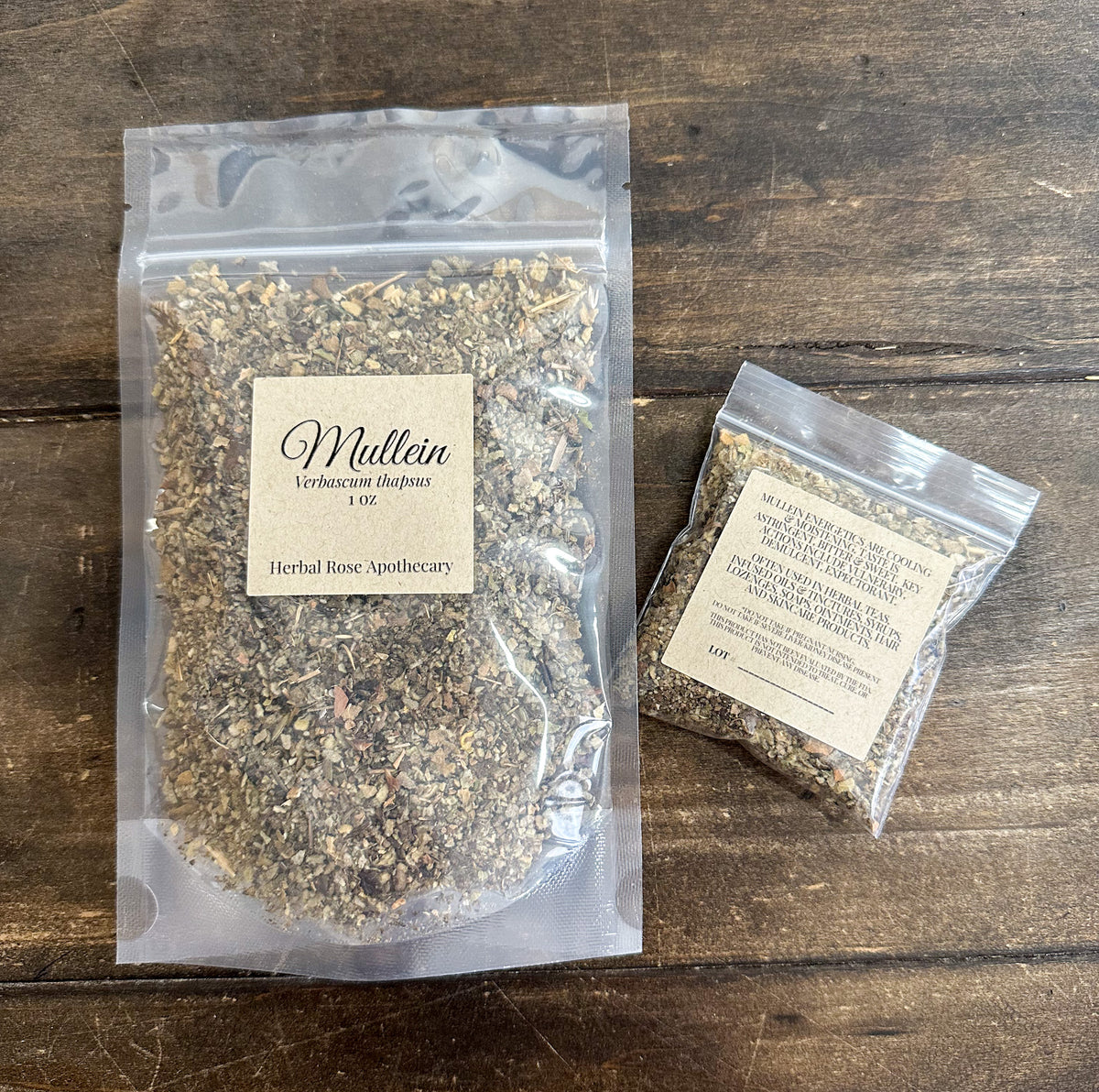 two packages of dried mullein in clear resealable bags on a wooden surface from herbal rose apothecary