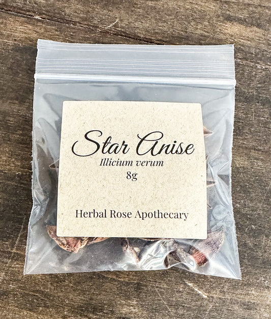 Clear bag with star anise and a label on a wooden surface