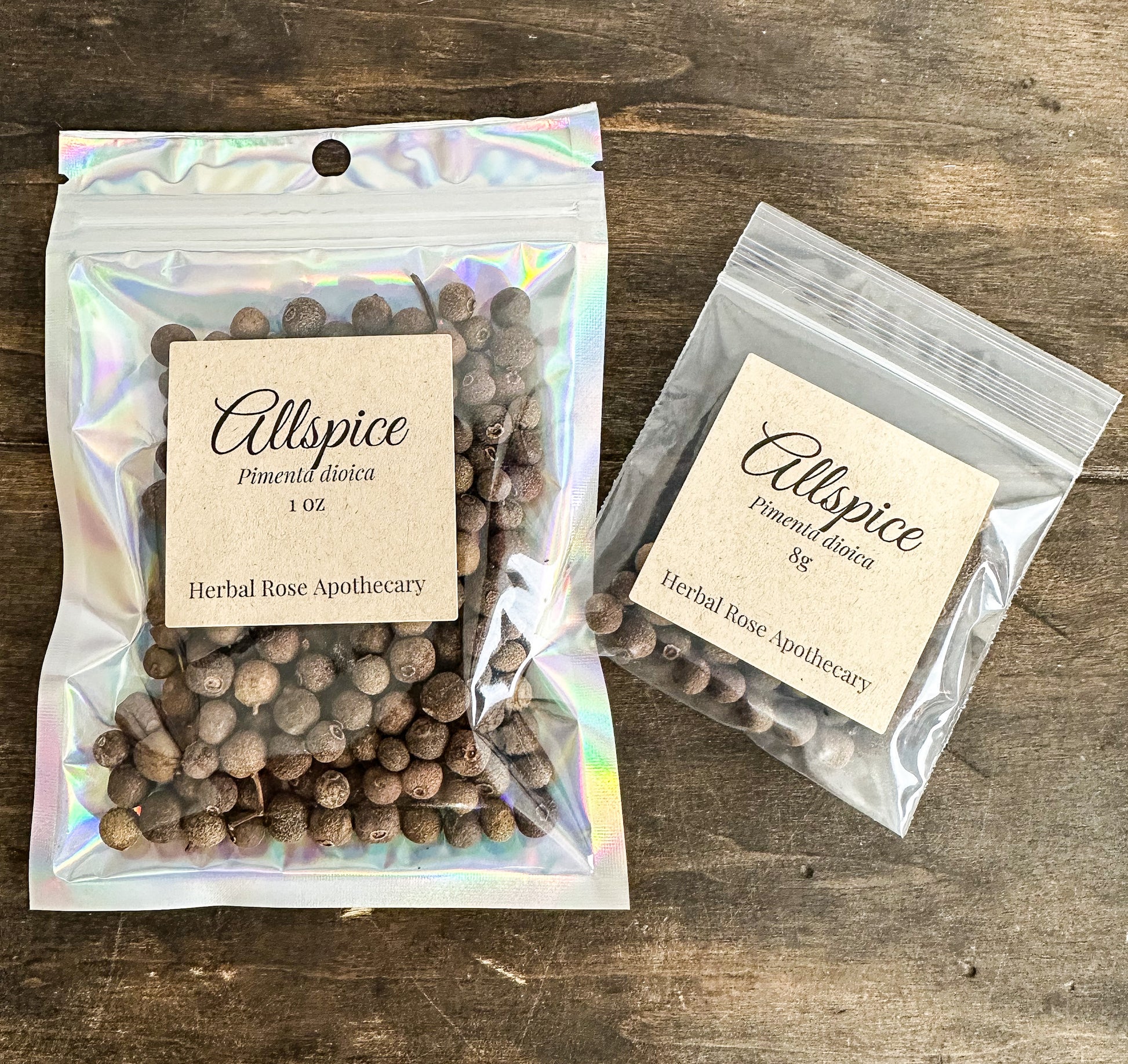 allspice 1oz and 8g bags packaged up on a wooden surface