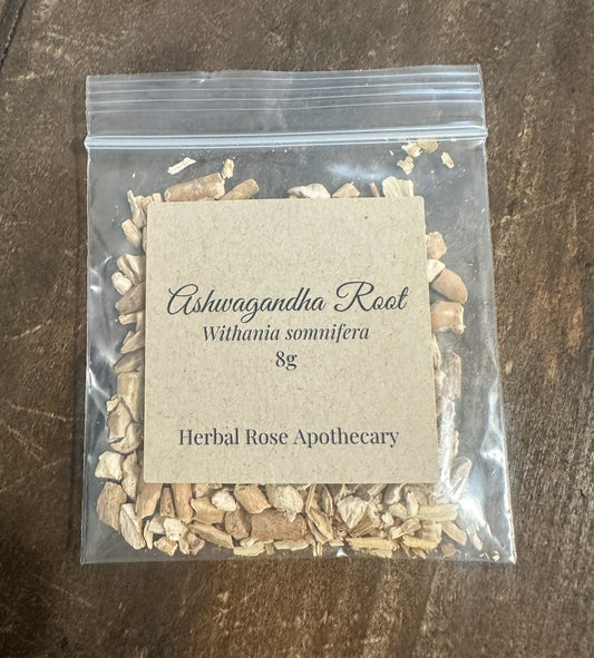 Packaged Ashwagandha Root 8g bag from Herbal Rose Apothecary on a wooden surface