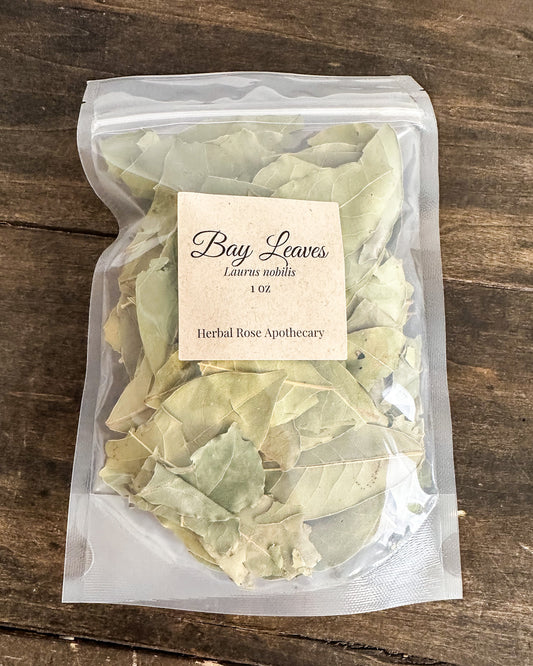 Bag of bay leaves 1oz with a label on a wooden surface