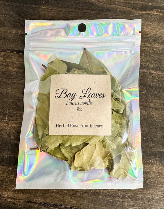 bay leaves 8g bag packaged in a holographic resealable bag on a wooden surface