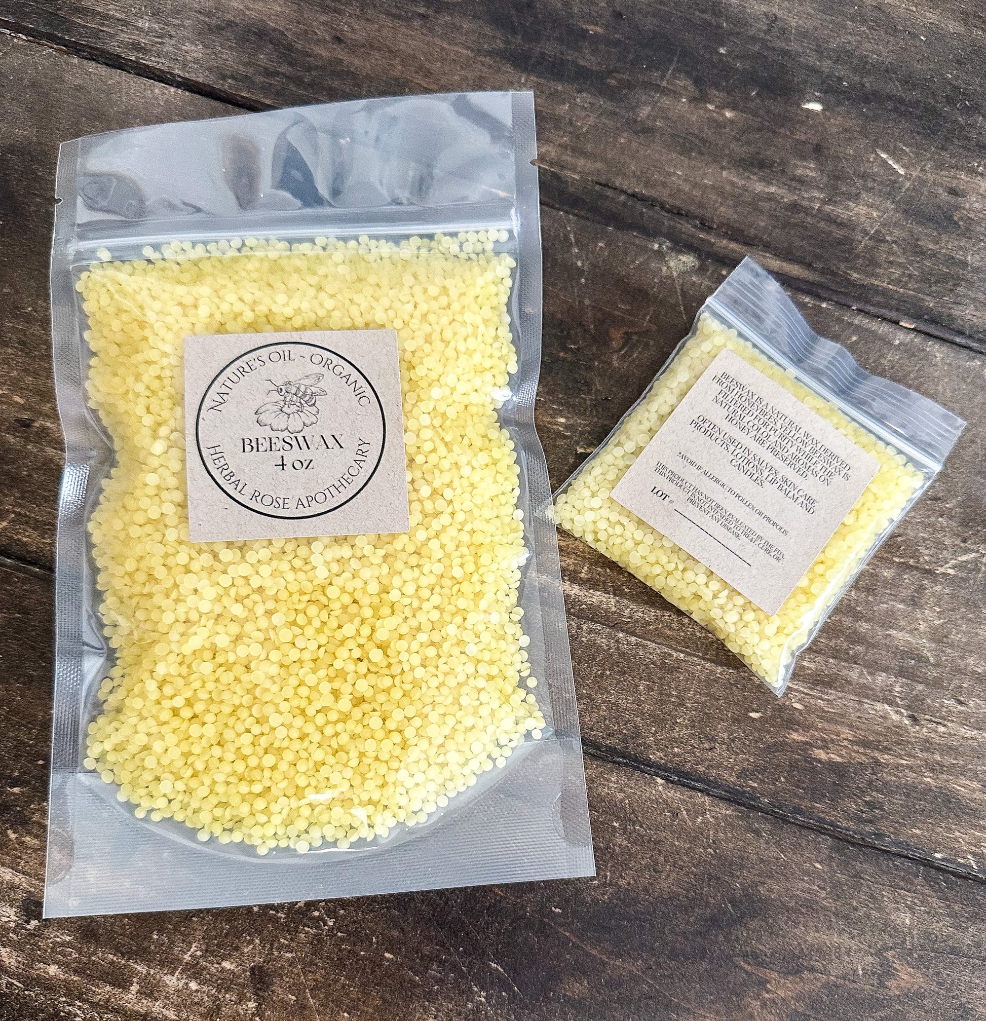 Two packages of yellow wax on a wooden surface