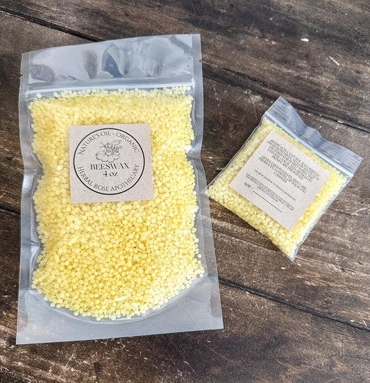 Two packages of yellow wax on a wooden surface