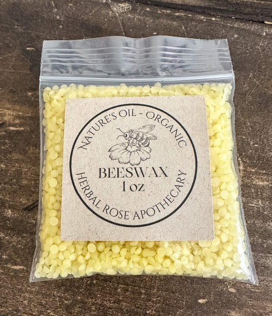 Packaged beeswax on a wooden surface with 'Natures Oil Organic' label.