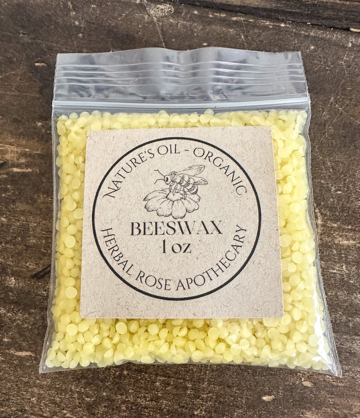 organic beeswax 1oz in clear resealable bag on wooden surface