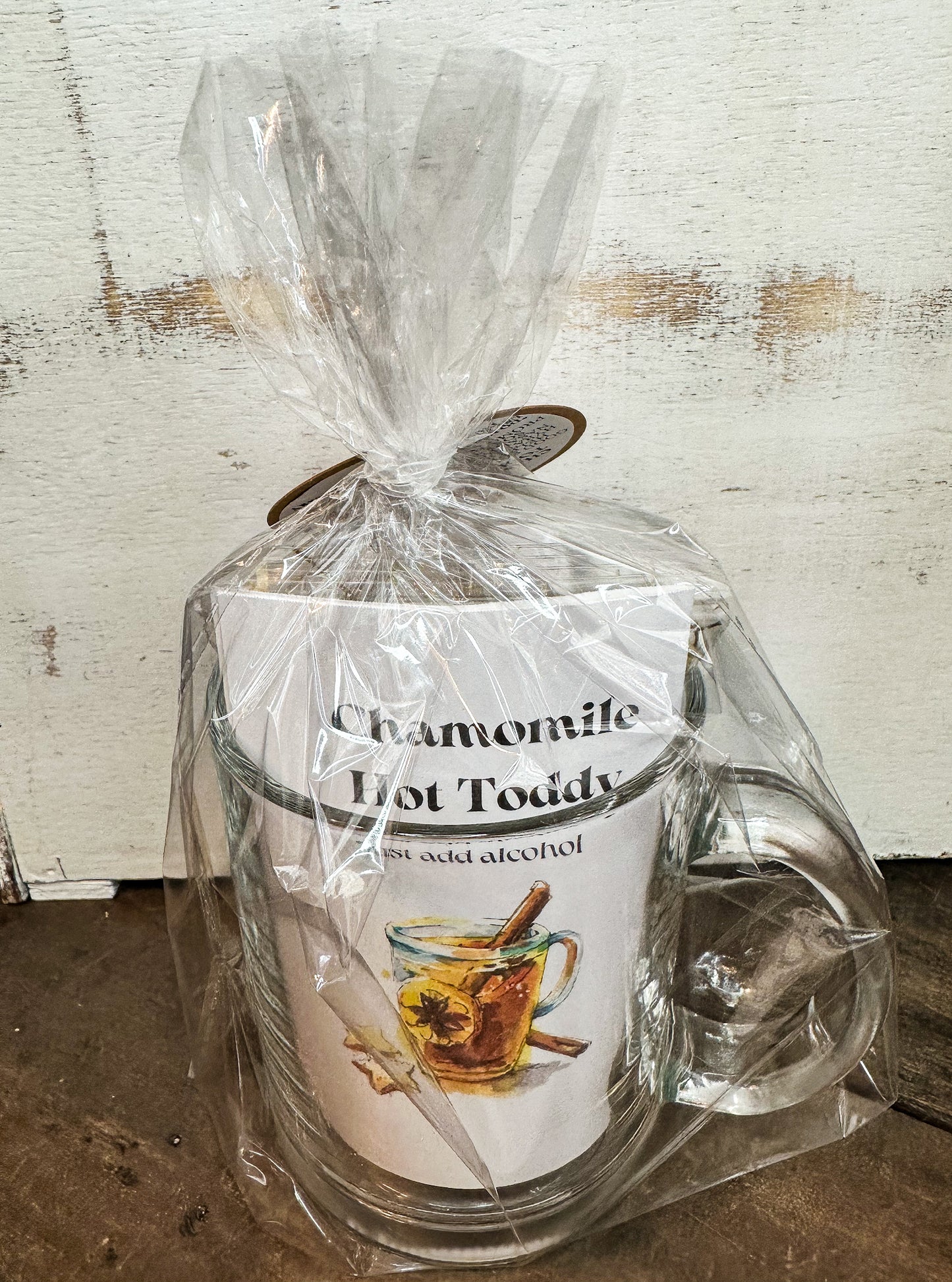 chamomile hot toddy back side gift set with white background and wooden table