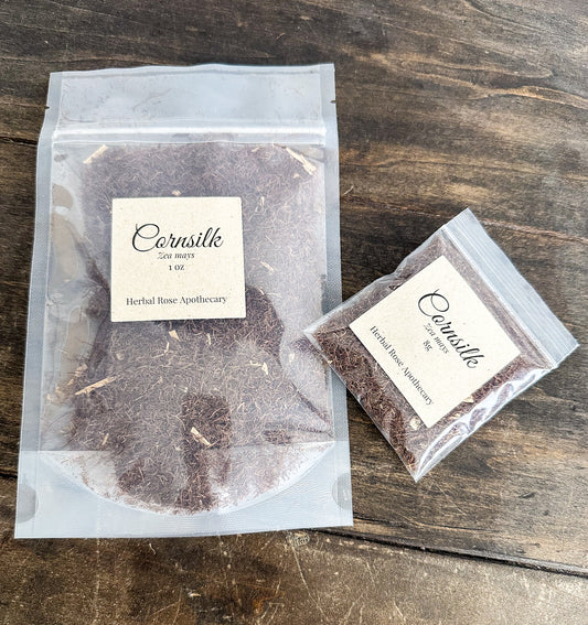 Two packages of Cornsilk from Herbal Rose Apothecary on a wooden surface