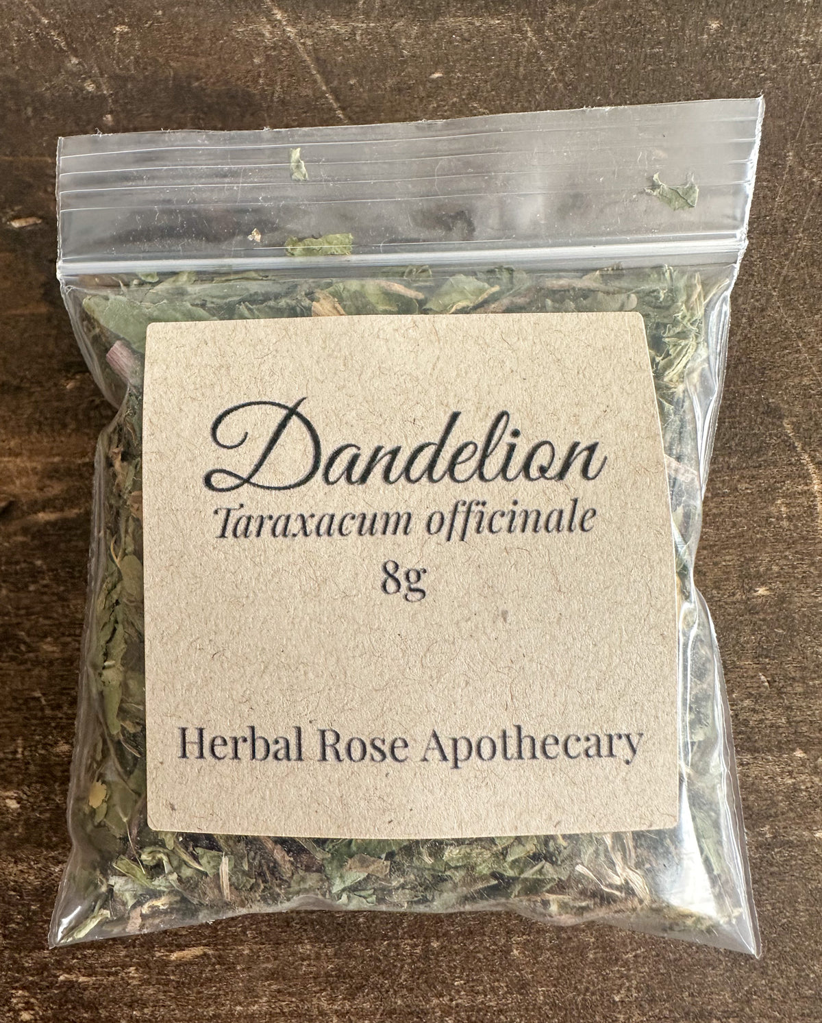 dandelion 8g bag on wooden surface