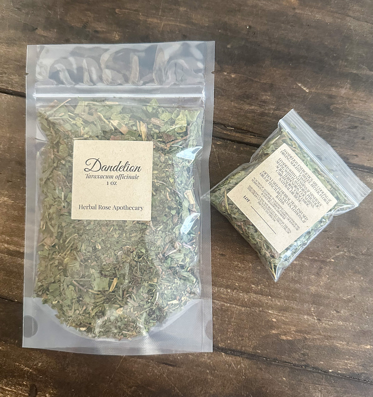 two packaged bags of dandelion herbs from herbal rose apothecary on a wooden surface