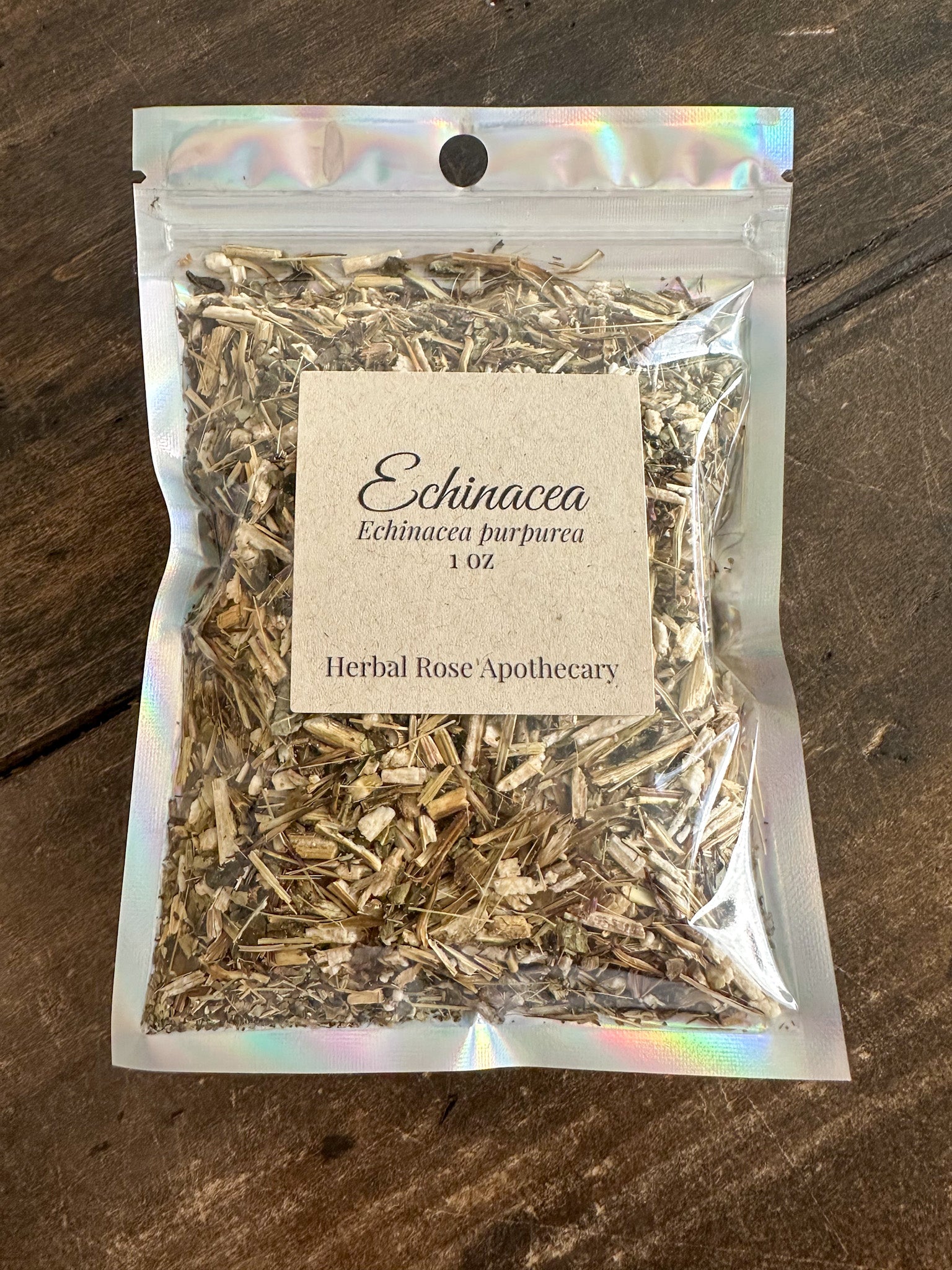 ehchinacea 1oz bag in holographic bag on wooden surface