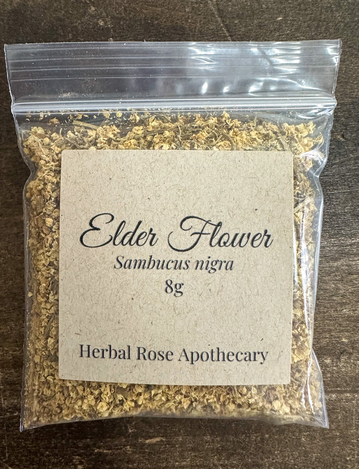 elder flowers 8g bag packaged on a wooden surface