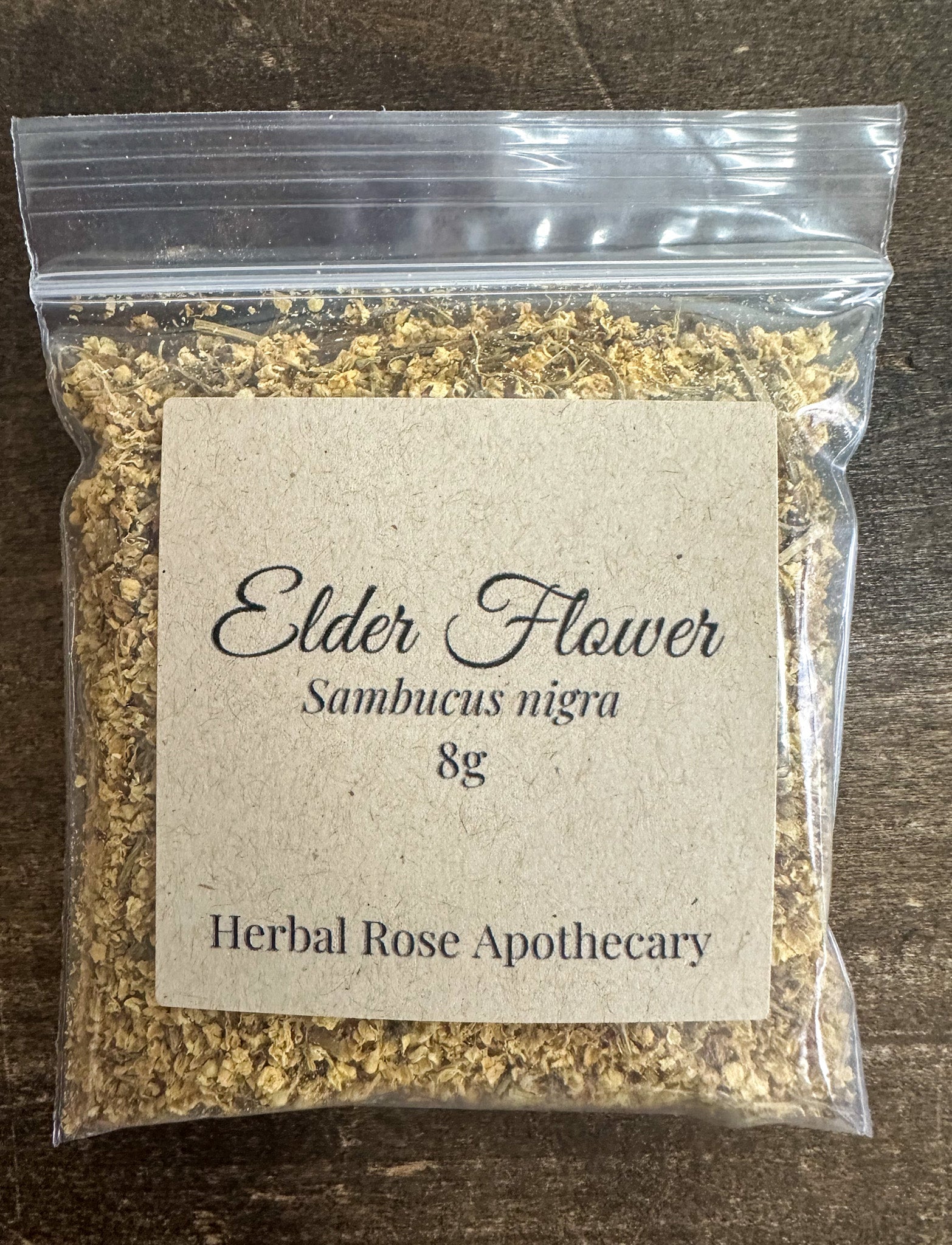 elder flowers 8g bag packaged on a wooden surface