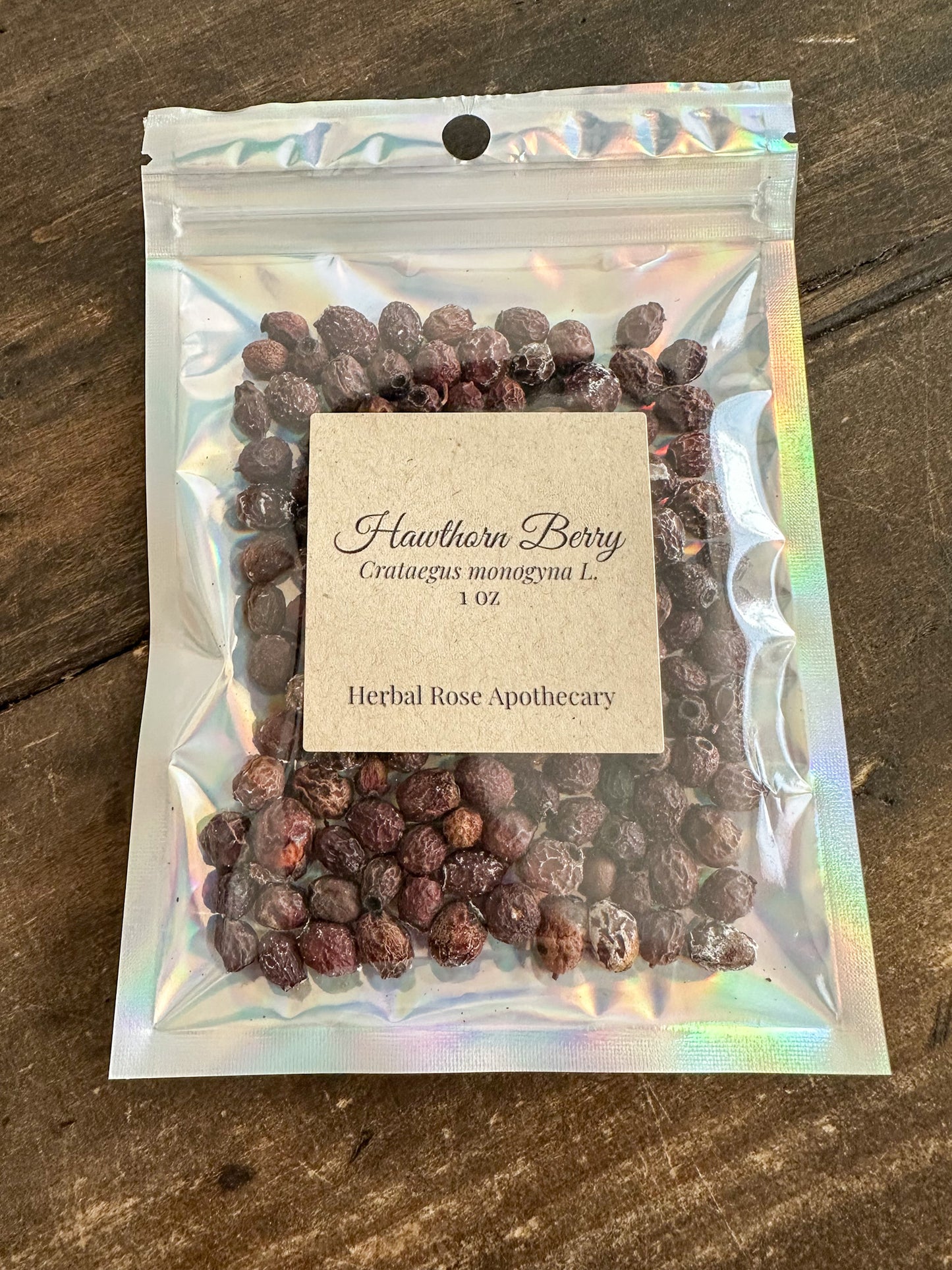 hawthorn berry 1oz bag in holographic bag on wooden surface from Herbal Rose Apothecary