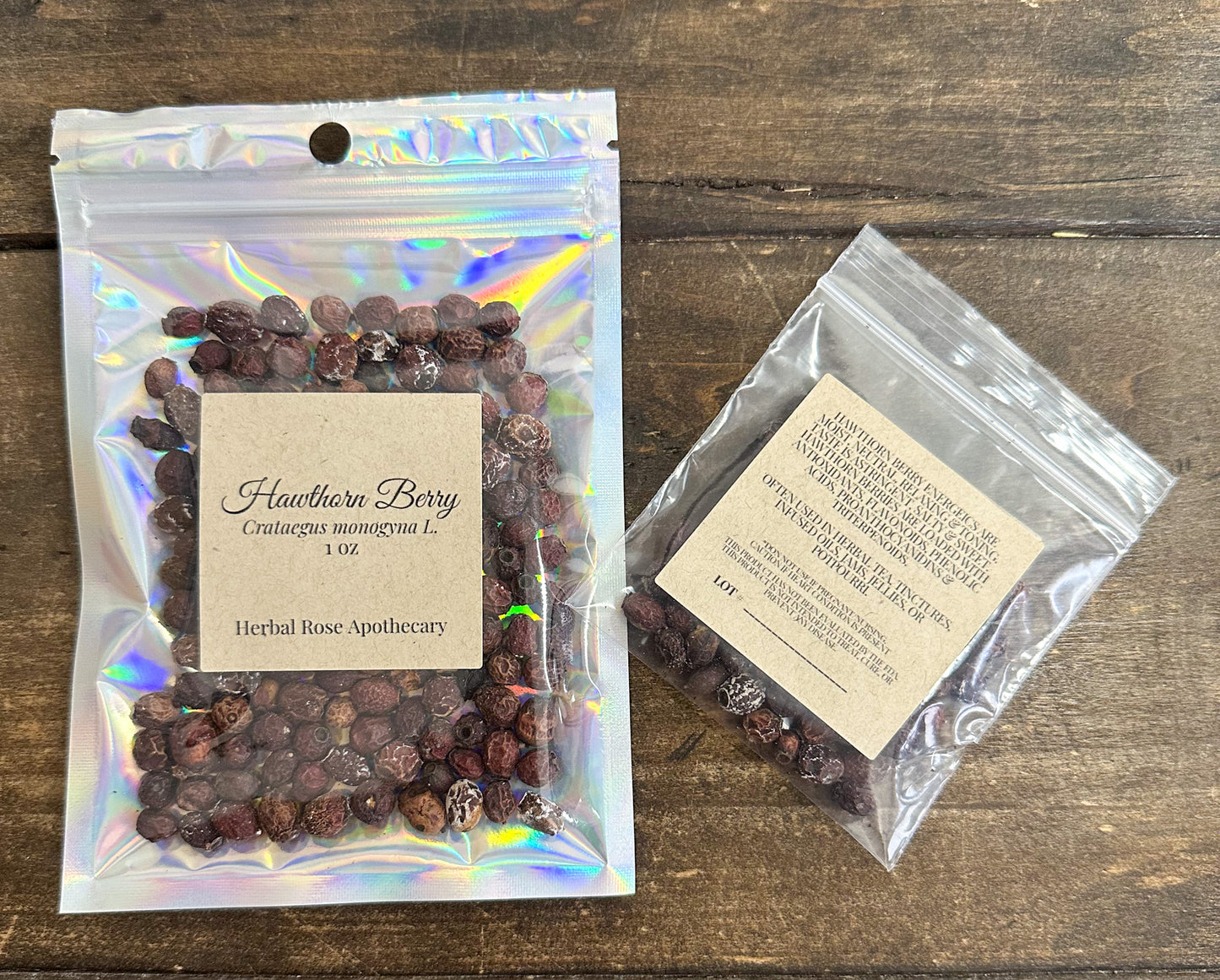 hawthorn berry packaged in two different bags, one clear bag and one holographic bag on a wooden surface