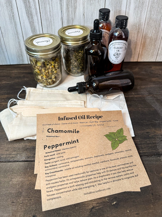 infused oil kit products, inside look with 2 herb jars 2 amber dropper bottles, 2 almond oils bottles, to muslin strainers, and information on herbs and directions