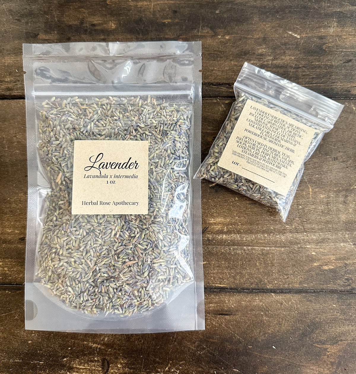 two packaged dried lavender herbs in clear bags laid out on a wooden surface from herbal rose apothecary