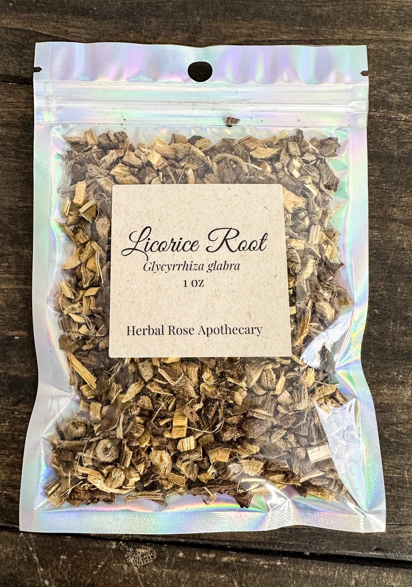 Packaged licorice root from Herbal Rose Apothecary on a wooden surface