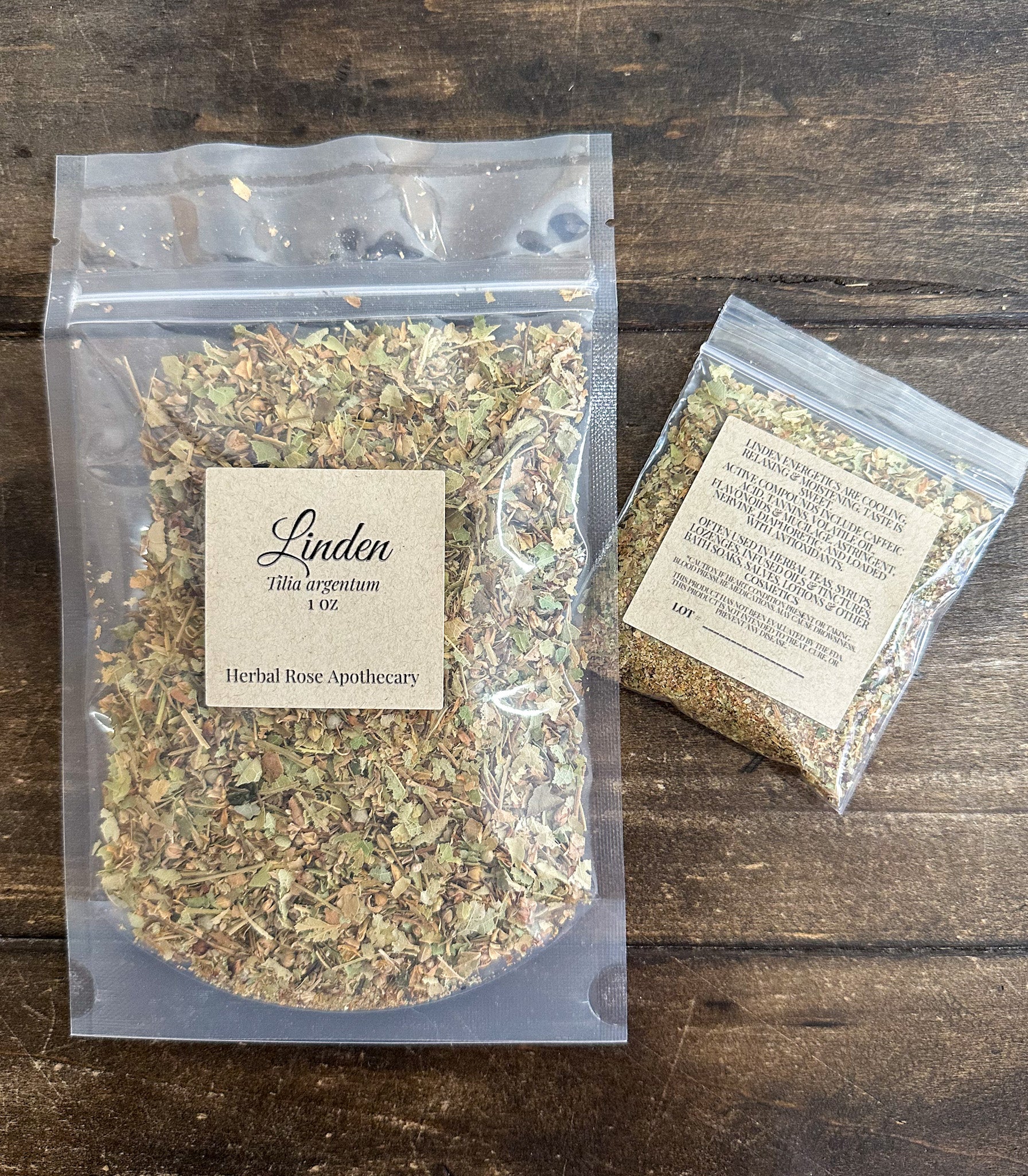 two packages of dried linden packaged in clear resealable bags laid on a wooden surface from herbal rose apothecary