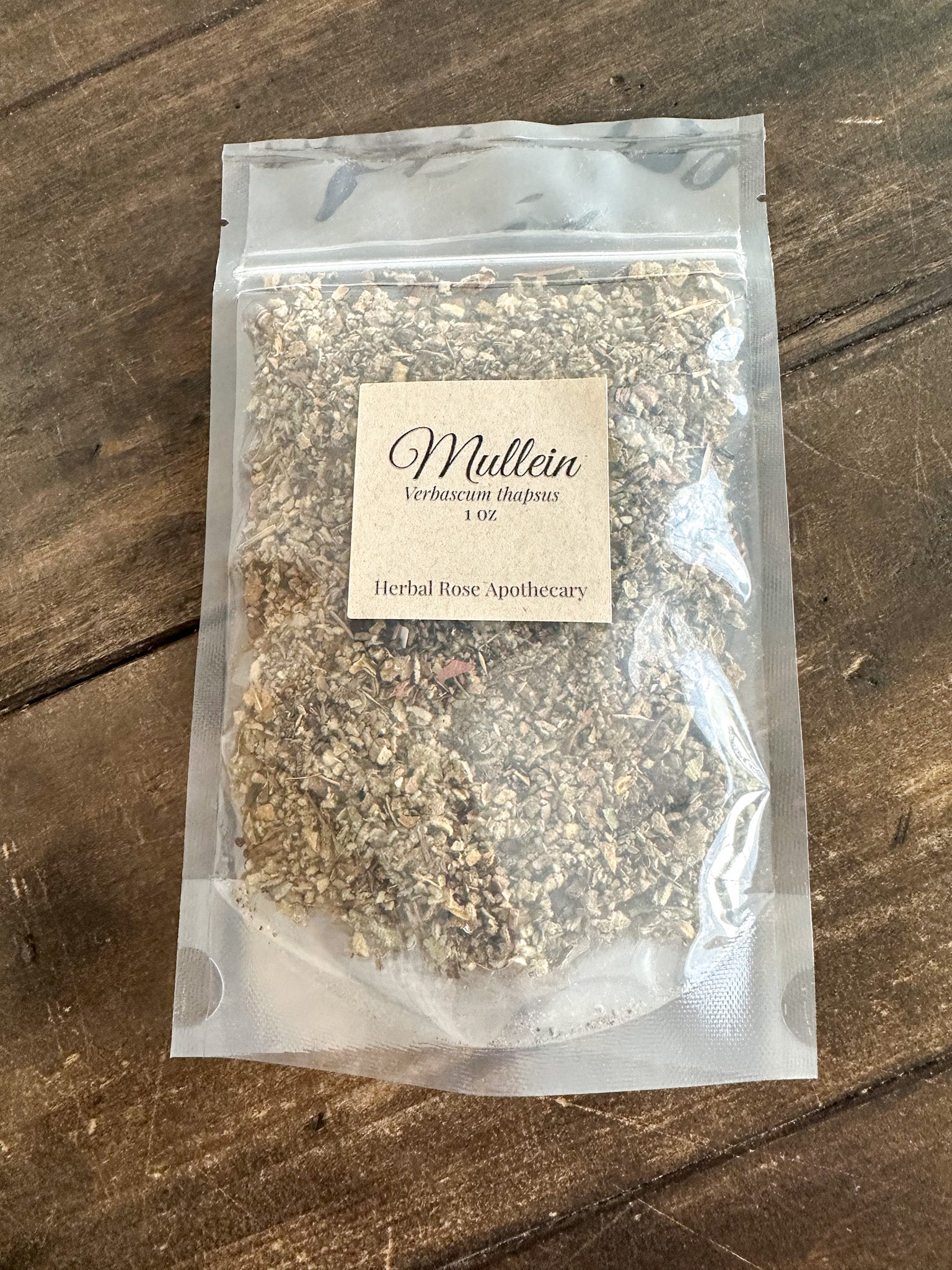 dried mullein leaf 1oz bag packaged into a clear resealable bag on a wooden surface