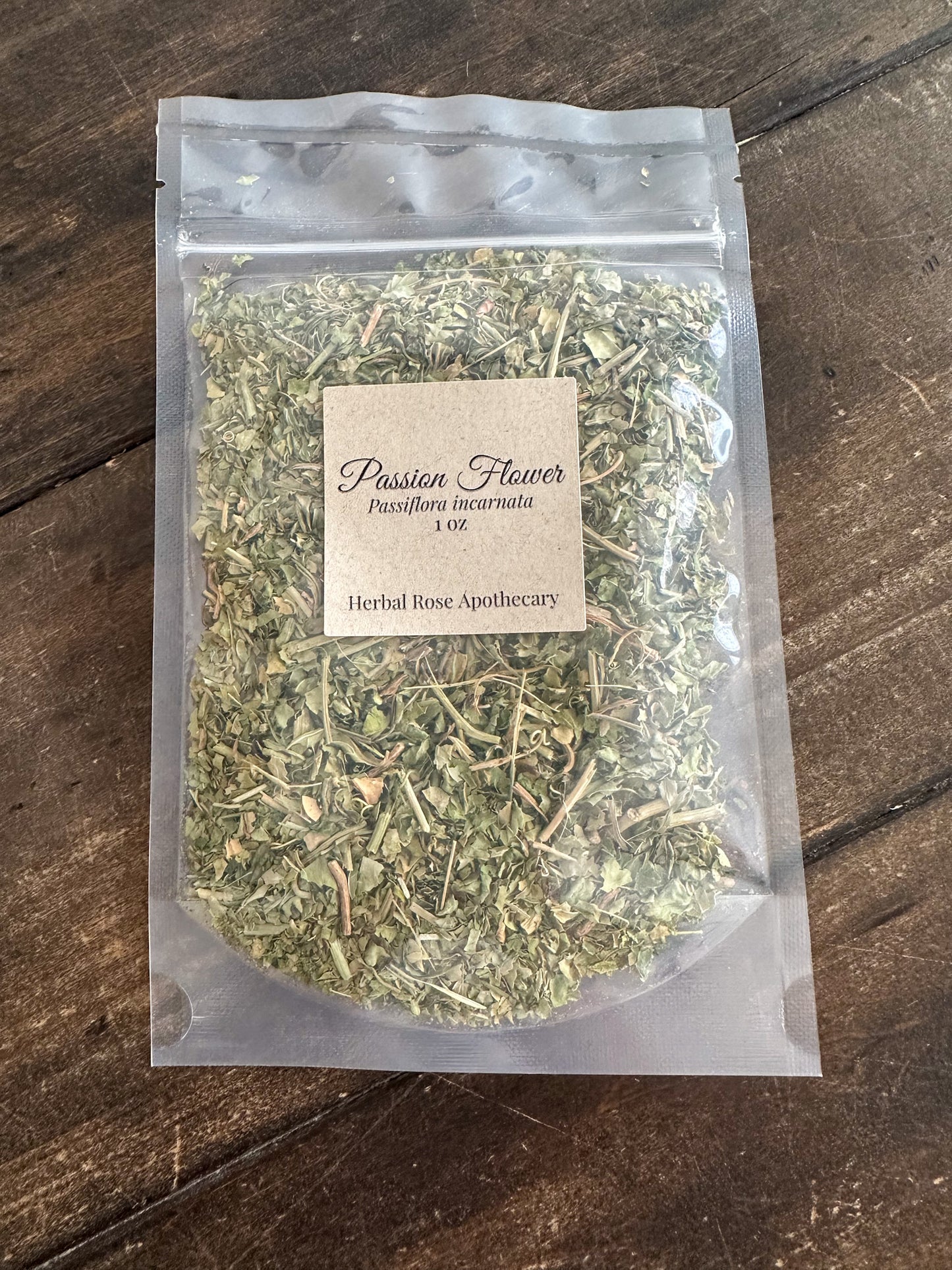 dried passion flower 1oz bag in clear resealable bag on wooden surface