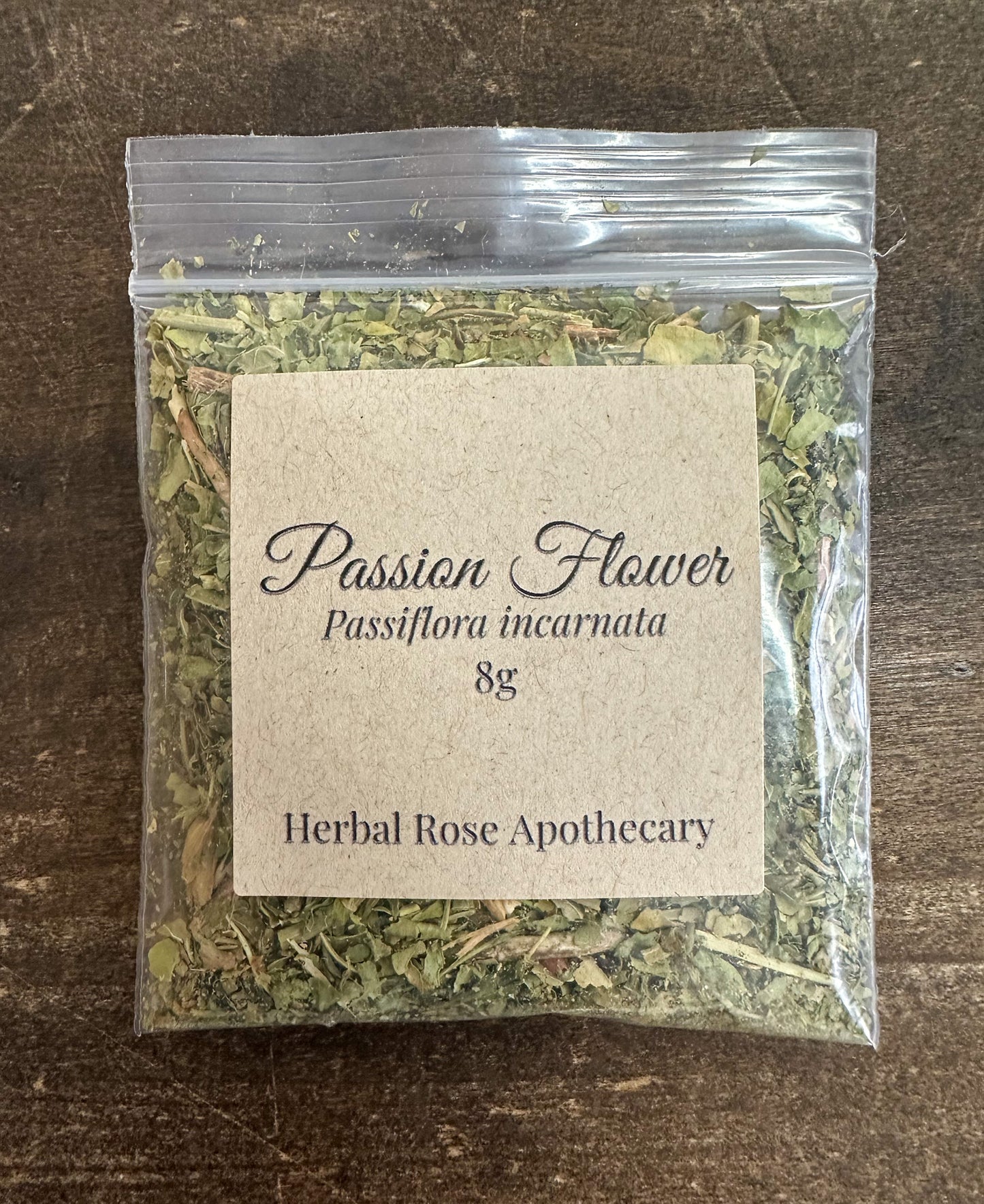 dried passion flower 8g bag in clear resealable bag on wooden surface