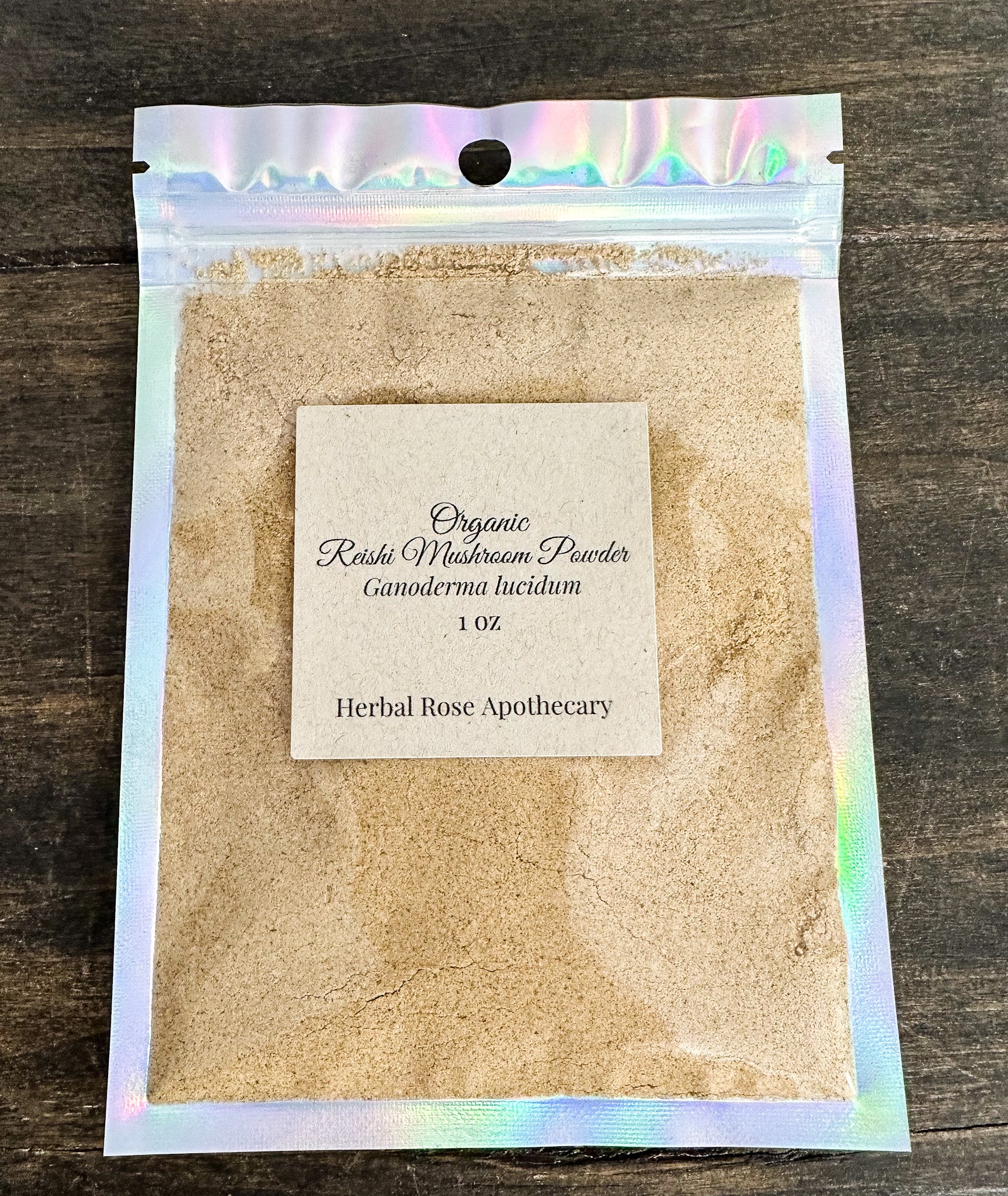 Package of Organic Reishi Mushroom Powder with a label on a wooden surface