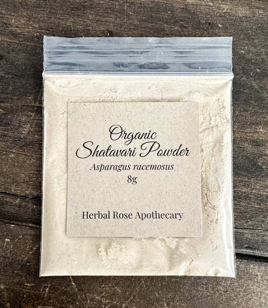 Packaged organic Shatavari Powder from Herbal Rose Apothecary on a wooden surface