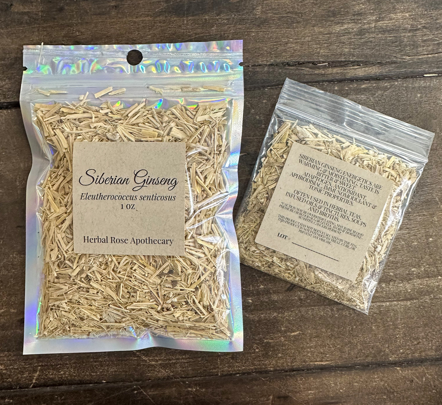 two packages of dried siberian ginseng in clear resealable bags from herbal rose apothecary on a wooden surface