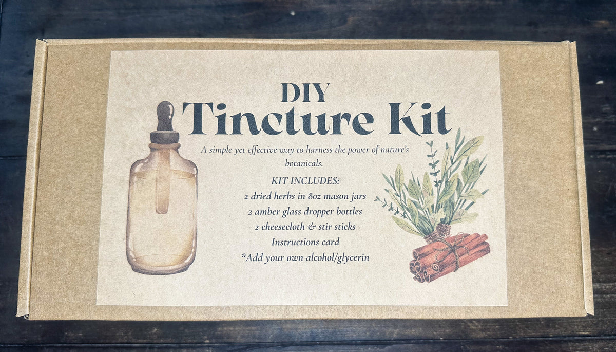 DIY tincture box kit with label indicating what kit includes inside on a wooden surface