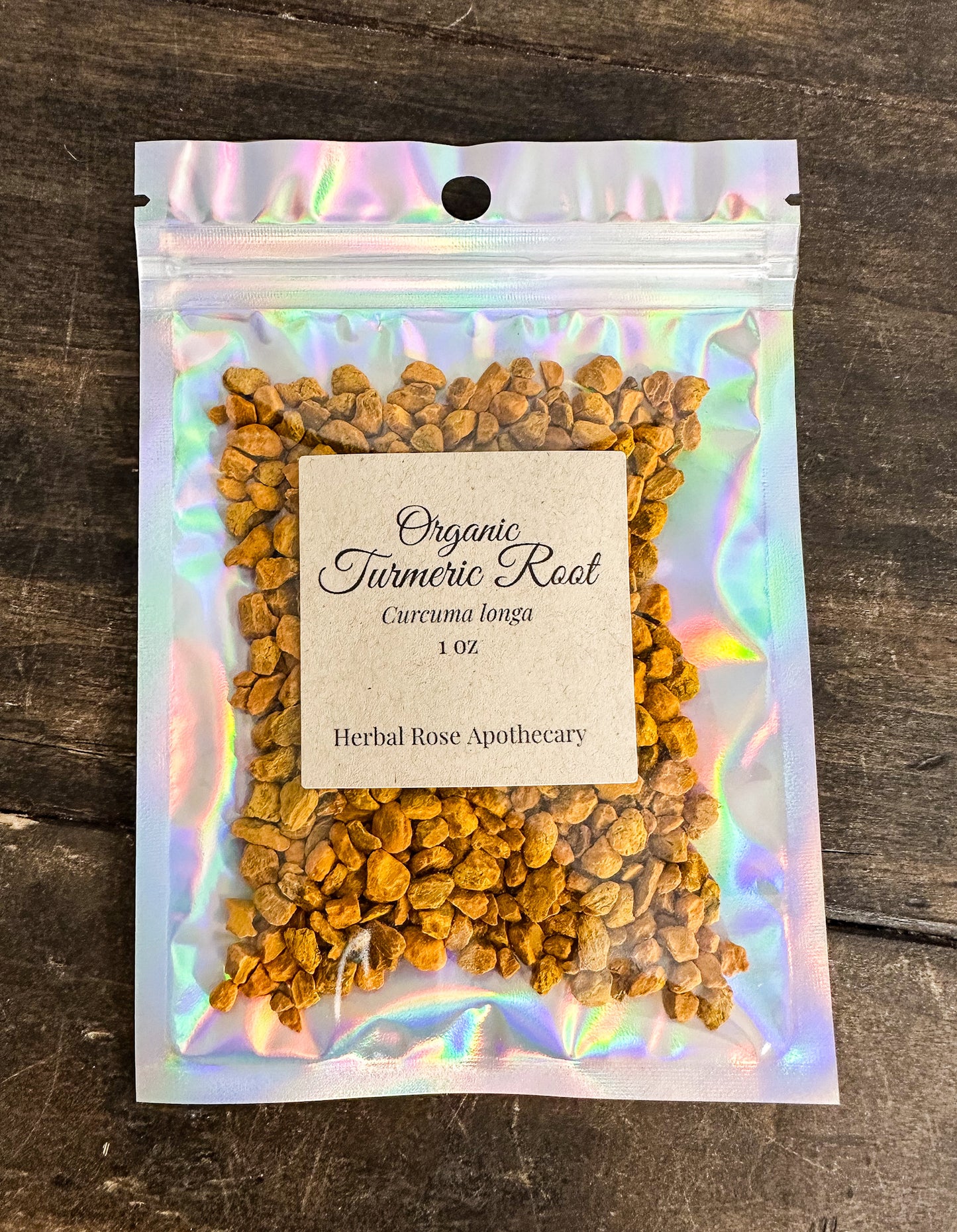 Package of organic turmeric root on a wooden surface