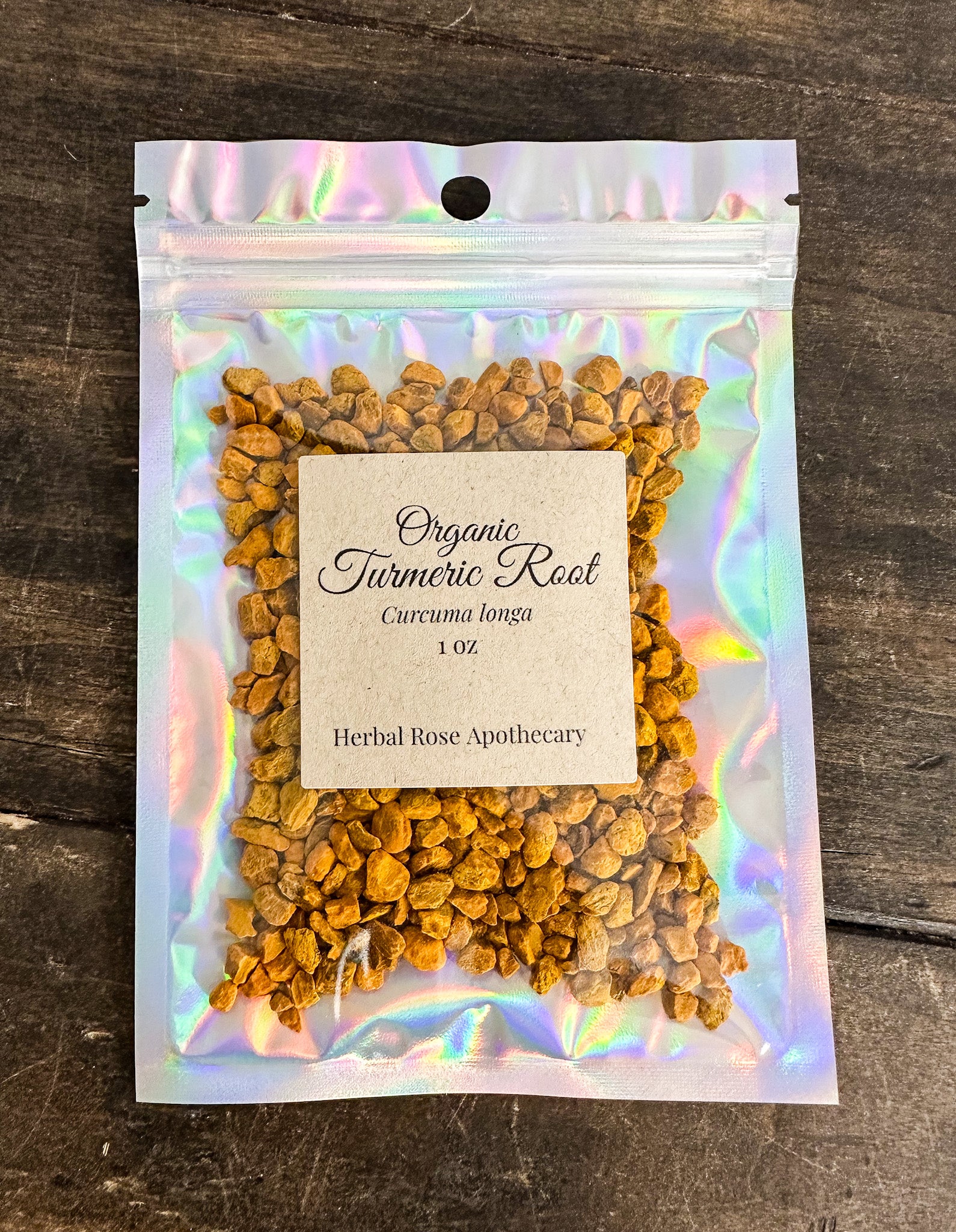 Package of organic turmeric root on a wooden surface