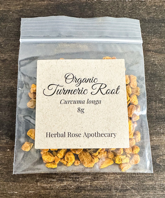 Bag of organic turmeric root with a label on a wooden surface