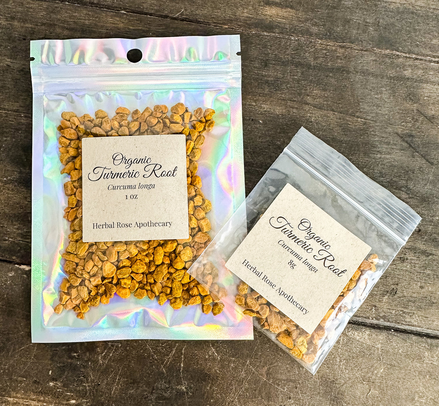 Two packages of organic turmeric root on a wooden surface