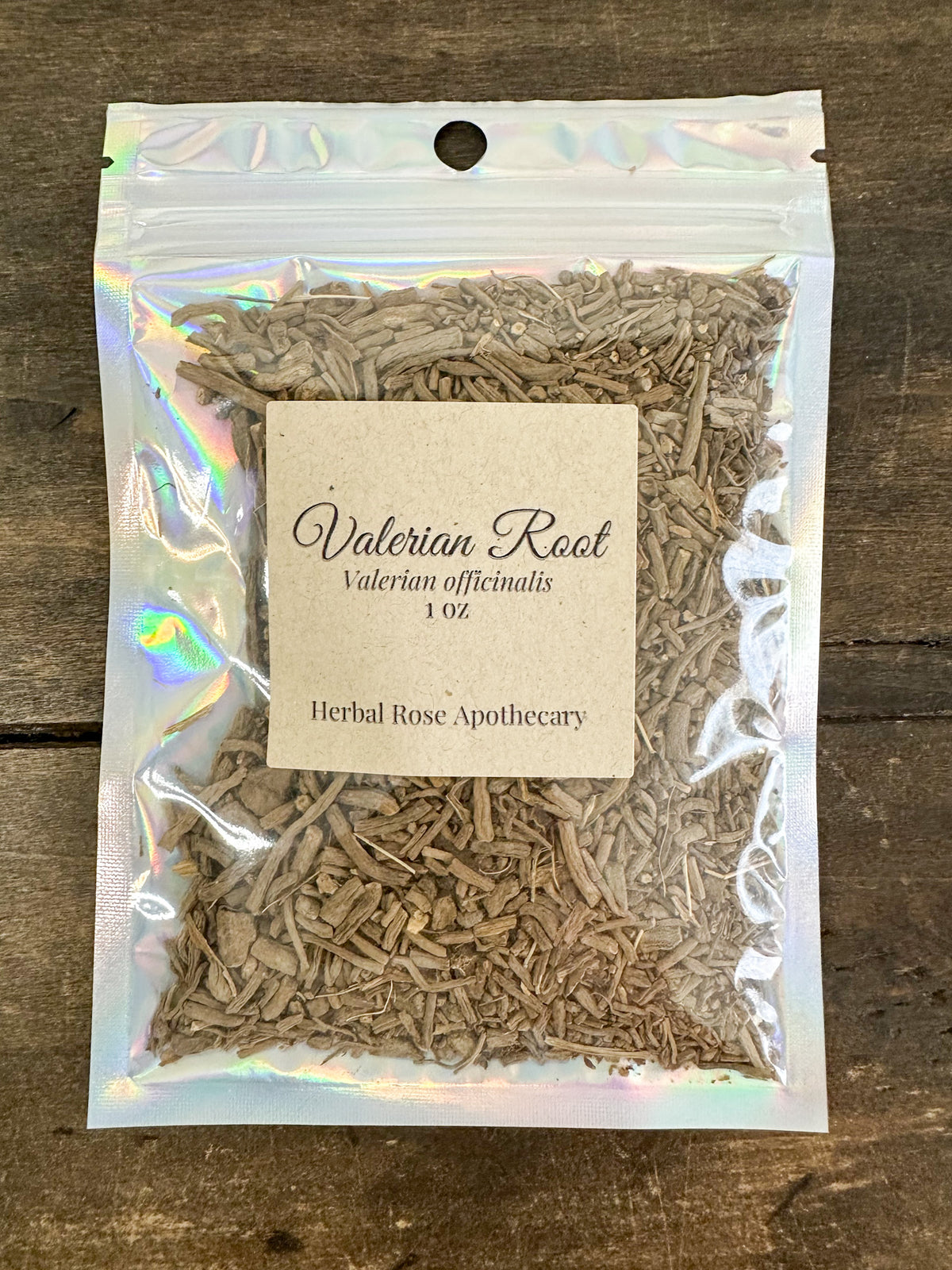 dried valerian root in 1oz holographic bag on wooden surface