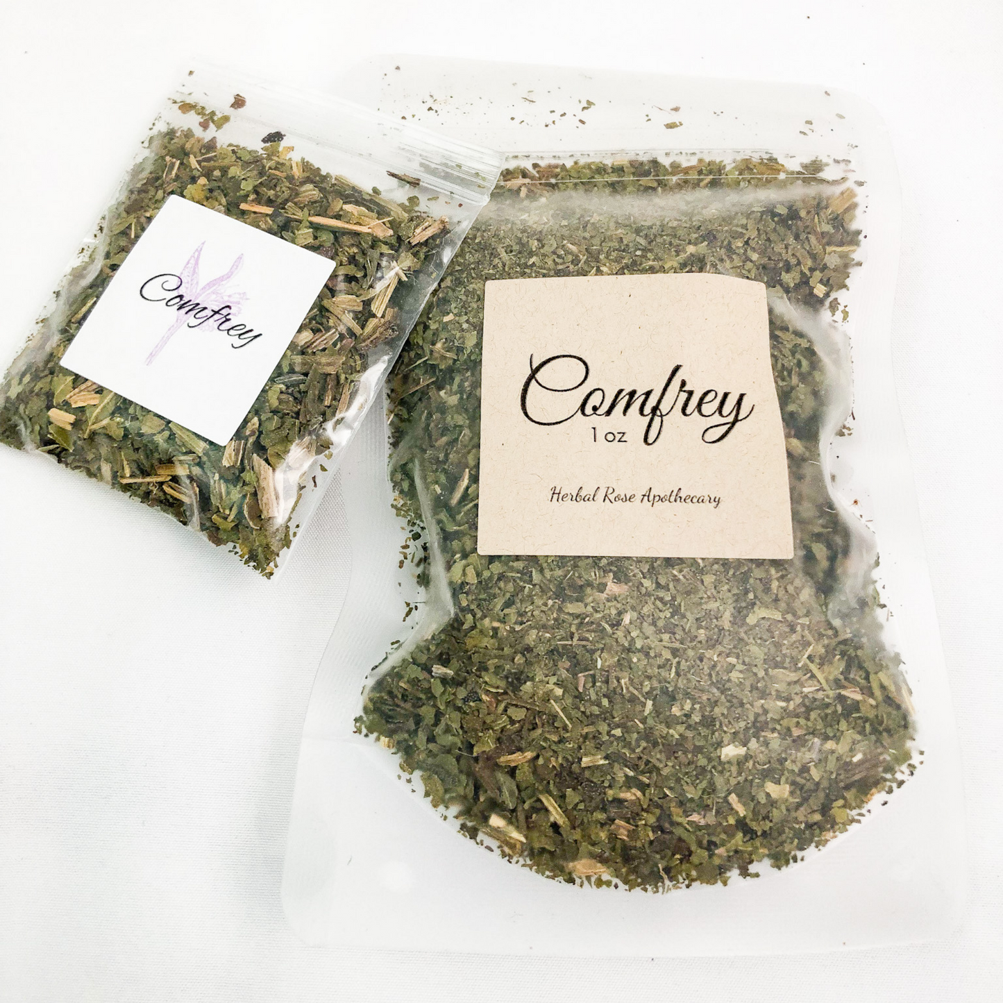 Dried comfrey in clear 1oz bag and clear 8g bag with white background