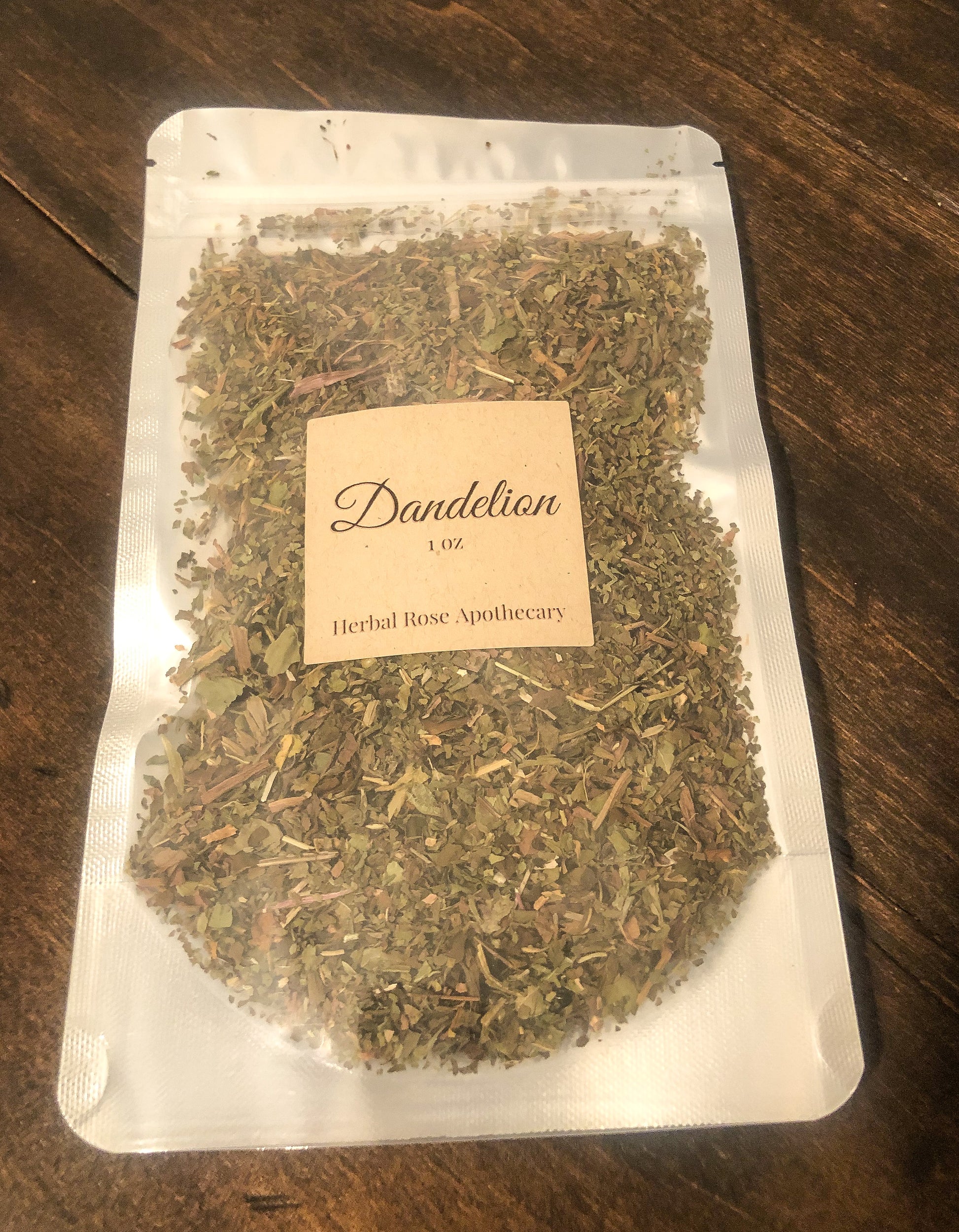 dandelion 1oz in clear bag on wooden background