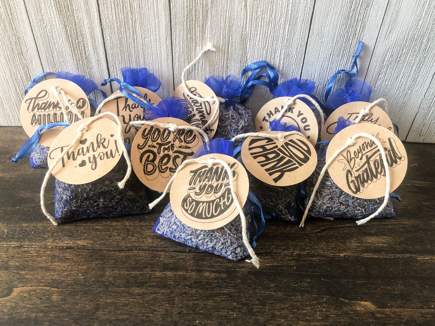 bulk potpourri sachets for party favors/appreciation gifts on wooden background