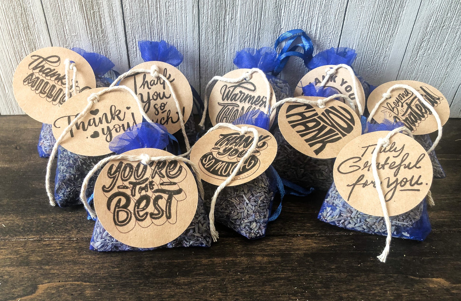 bulk potpourri sachets for party favors/appreciation gifts on wooden background