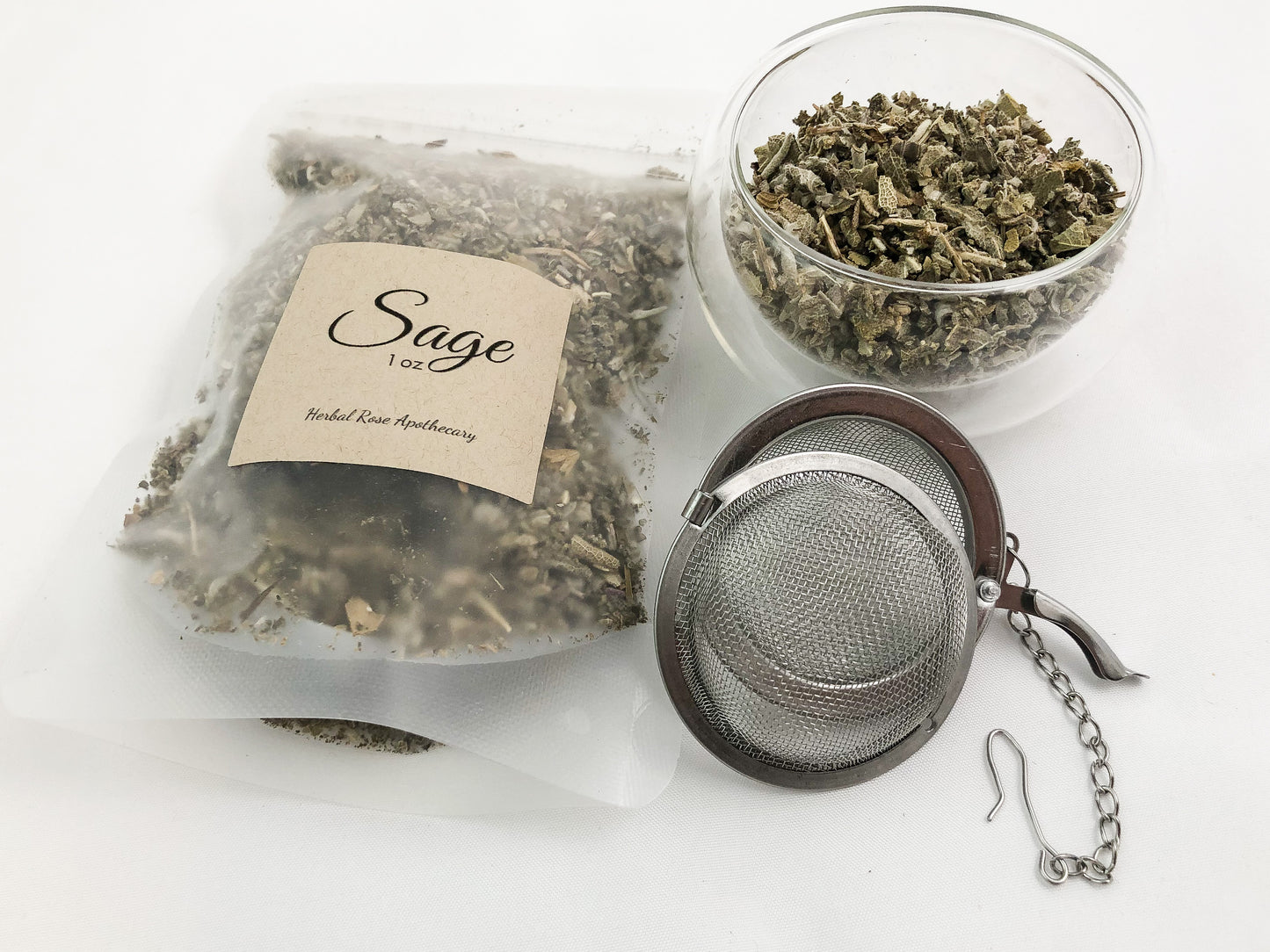 image of dried sage in a 1oz clear bag next to dried sage in clear glass cup and mesh tea infuser with white background